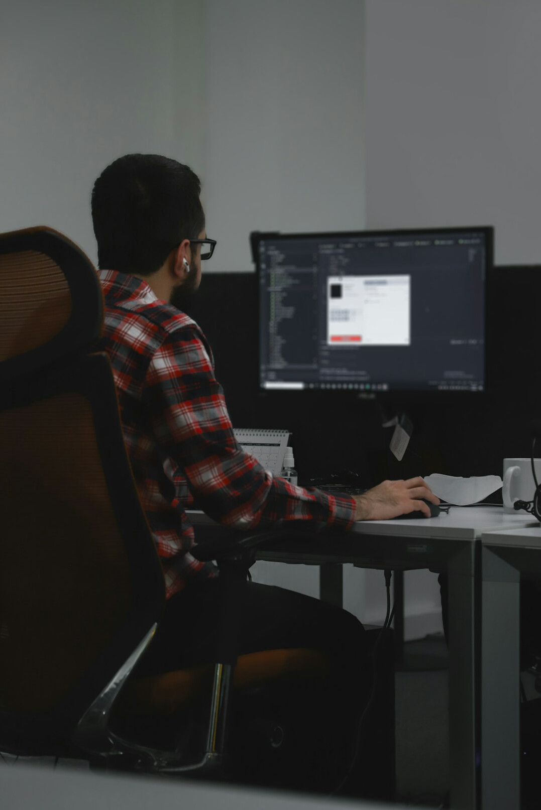 programmer coding at desk